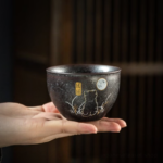 hand painted black ceramic japanese cat tea cup with good fortune motif