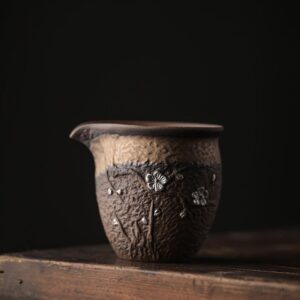 handmade coarse pottery plum blossom silver inlaid fairness cup gong dao bei side view