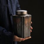 front view of bronze glaze japanese ceramic tea canister