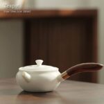 full side view of 6oz white porcelain kyusu teapot with wooden side handle