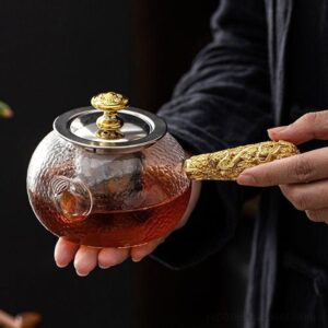 full view of handcrafted 4oz japanese glass kyusu teapot with golden carved handle