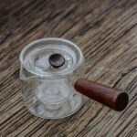 full view of japanese glass kyusu teapot with wooden handle