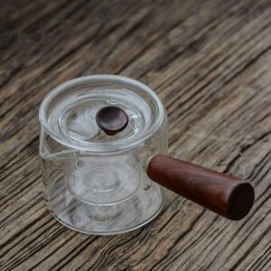 full view of japanese glass kyusu teapot with wooden handle