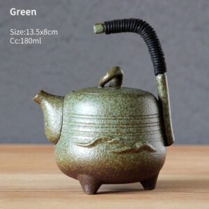 green handcrafted traditional japanese teapot with embossed landscape pattern