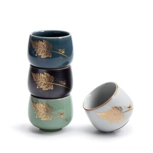hand-decorated japanese tea cup with gold leaf and insect motif side view
