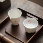 hand-painted fish japanese fairness cup with tea strainer side view