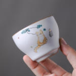 collection of hand-painted japanese ceramic tea cups cat landscape peony