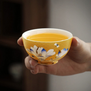 hand-painted yellow japanese tea bowl with gold magnolia accent