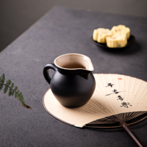 handcrafted black clay japanese fairness cup gong dao bei side view