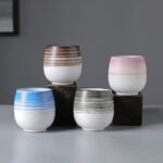 collection of handcrafted japanese ceramic tea cups with textured stripe design