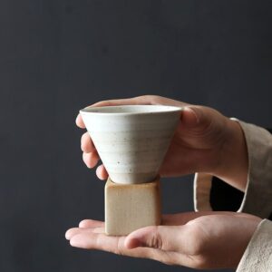 handcrafted japanese ceramic tea cup with square ceramic saucer