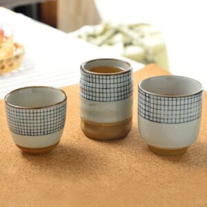 collection of handcrafted japanese ceramic tea cups blue check pattern
