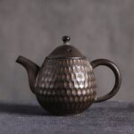 full product view of handcrafted japanese honeycomb textured small ceramic teapot