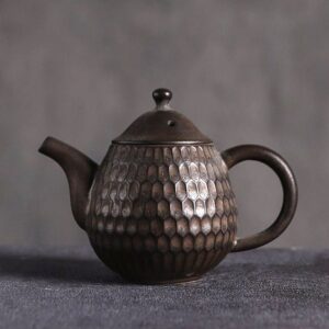 full product view of handcrafted japanese honeycomb textured small ceramic teapot