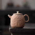handcrafted japanese rough clay teapot with 999 silver accent full product view