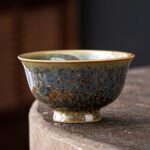 handcrafted japanese tea bowl blue green glaze with golden oil spot glaze