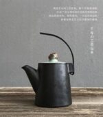 Handcrafted black Japanese teapot with natural stone knob main product view