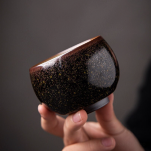 handcrafted speckled gold black japanese tea bowl with gold speckles