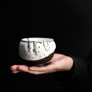 handcrafted wabi-sabi japanese tea bowl with gold speckle glaze