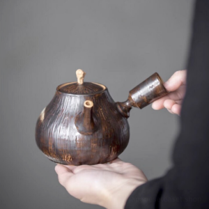 front view of handcrafted wood grain ceramic kyusu teapot side handle