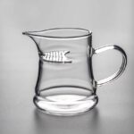 10oz handled Japanese glass fairness cup with built-in strainer side view