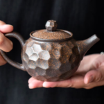 handmade japanese gilded ceramic teapot style a close up texture view