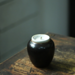 Handmade Japanese wabi-sabi black ceramic loose leaf tea canister product main view