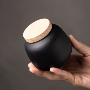 japanese black ceramic tea canister with natural wood lid main view