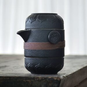 japanese style black ceramic portable travel tea set with carved lotus and fuku design