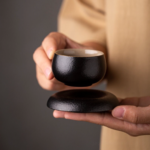 handcrafted japanese black clay tea cup with saucer