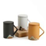 japanese matte ceramic loose leaf tea infuser mug with mountain pattern side view