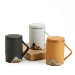 japanese matte ceramic loose leaf tea infuser mug with mountain pattern side view