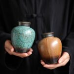 hand holding japanese style ceramic tea caddy, sealed tea canister for loose tea