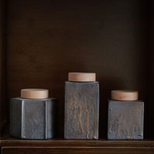 Handcrafted Japanese style ceramic tea canister with natural wooden lid group display