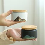 handcrafted japanese ceramic tea canister with natural bamboo lid mountain pattern