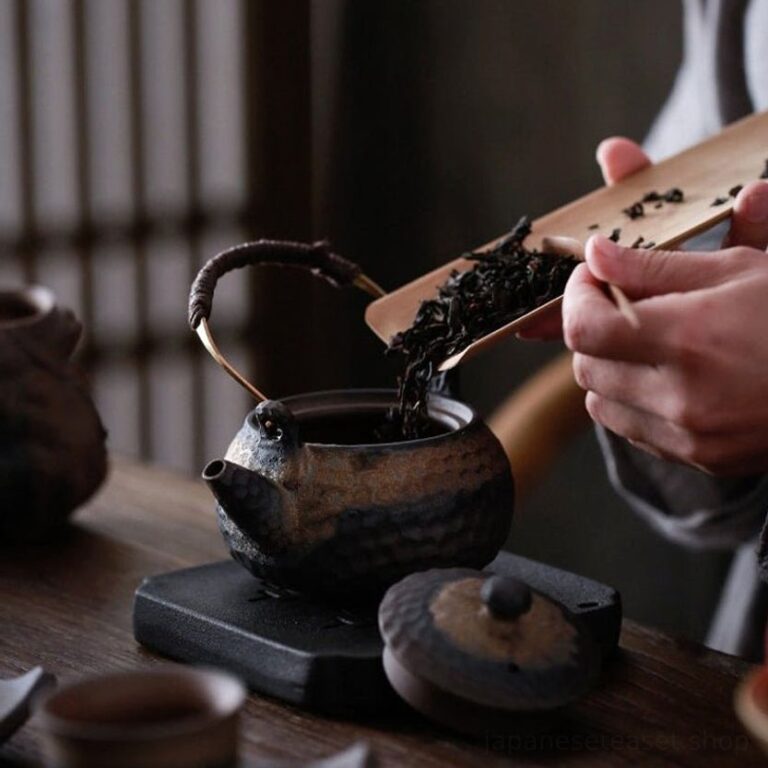 Japanese tea set, close up of braided wrapped handle on japanese ceramic teapot