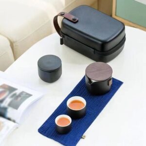 full display of open portable Japanese ceramic travel tea set with all pieces