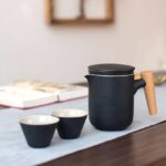open japanese ceramic travel tea set with teapot and two teacups