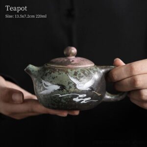 full side view of handcrafted japanese crane kiln ceramic teapot