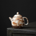 japanese dragon egg handmade ceramic teapot with brown streaked glaze main view