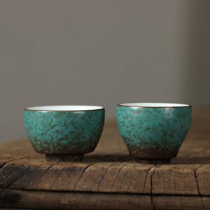 handcrafted japanese green porcelain tea cup with natural brown crackle glaze