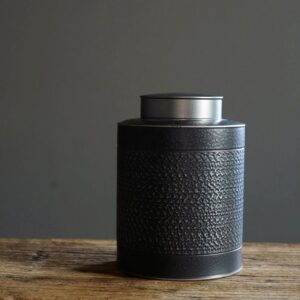 japanese style black hammered ceramic airtight tea canister front view