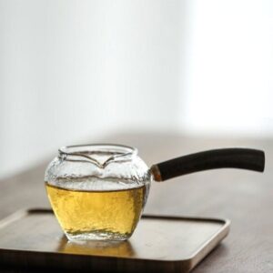 Japanese hammered glass fairness cup with dark wood handle main view