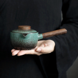 Full view of handmade green-black gradient Japanese kyusu teapot side handle