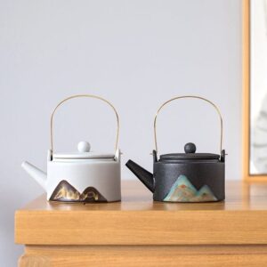 handmade japanese mountain ceramic teapot with golden metal handle