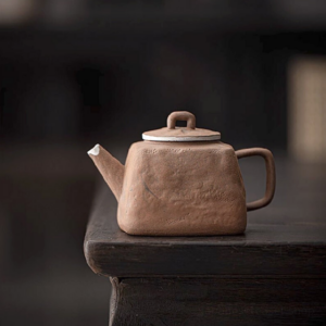 japanese old clay teapot front view with silver accent