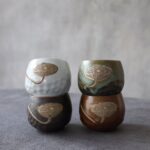 handcrafted japanese porcelain lotus tea cup main product view