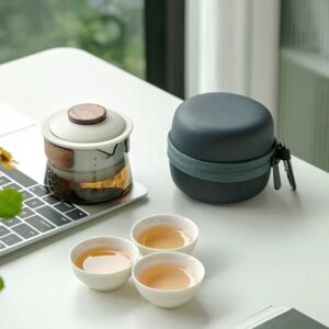 full opened japanese portable travel glass tea set with teapot teacups and carrying case
