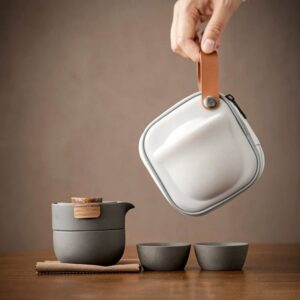 full view of compact dark grey japanese ceramic travel tea set with wood handle