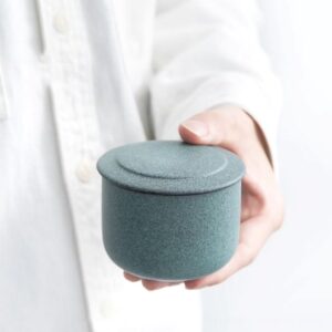 japanese tea canister green mottled ceramic tea storage jar side view